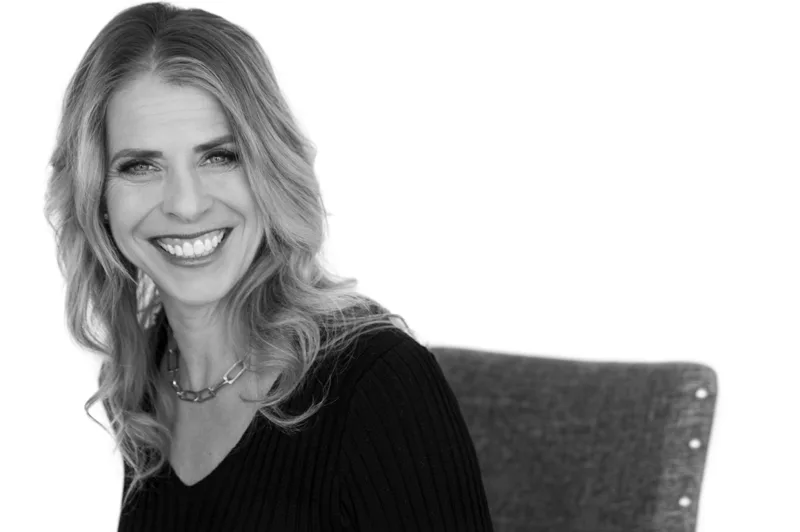 Professional headshot of woman with blonde hair